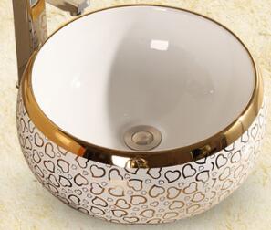 Golden pattern round wash basin
